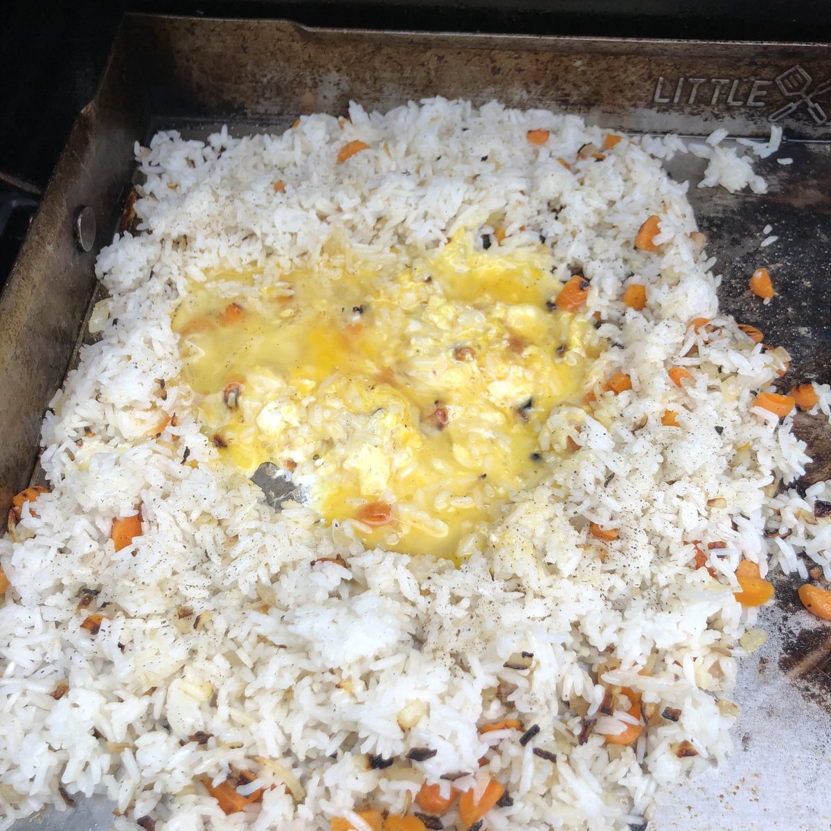 Next, spread out your minced veggies, pour on a little oil or butter, and cover them up with white rice. Toss it around with your spatulas until the minced veggies & rice are well-mixed.Then, cook your 2 eggs until they’re scrambled and mix it evenly into the rice.