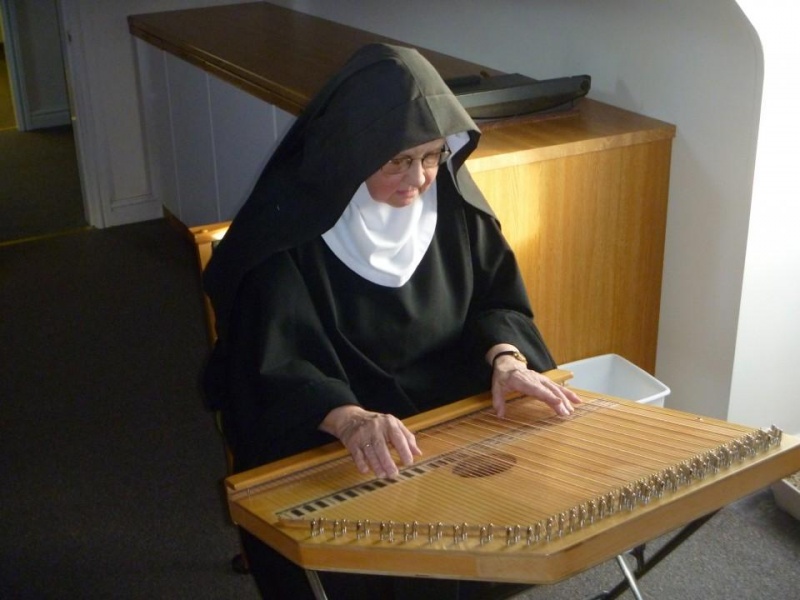 The 3rd women's monastery part of the EBC is Curzon Park, Chester.I have never been there or met any of their nuns but there is a lovely picture on the EBC website of a Sister playing the zither. https://www.benedictines.org.uk/our-houses/curzon-park-abbey5/8