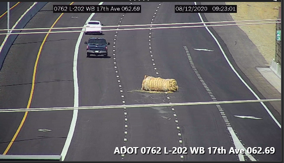 ArizonaDOT's tweet photo. L-202 WB near 17th Ave: A huge bale of is in the roadway, blocking the two right lanes. #phxtraffic https://t.co/rRpIqkN5DF