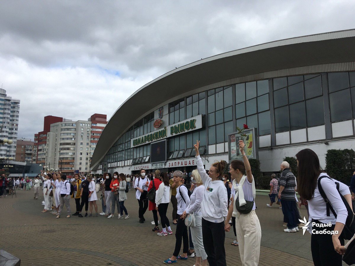 hundreds of women dressed in white stay in chain expressing solidarity with all the victims of police brutality in Minsk (near the Kamarouski market)