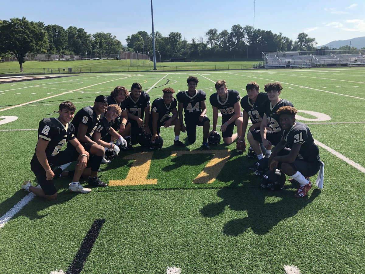 Berks Catholic players gather around memorial tribute to their fallen teammate Anthony Myers today during Reading Eagle photo day. #17Strong #berksgameday