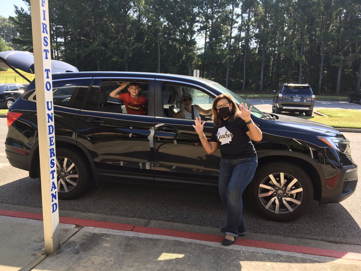 Summit Hill ES deploying our student devices. Dr. Bearden greets family with a device and school materials. @summithillhusky <a href="/lorriebearden/">Lorrie Bearden, Ed.D.</a>
