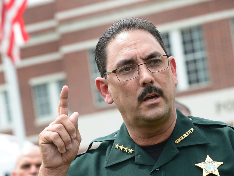 TPM's tweet photo. FL Sheriff Bans Deputies From Wearing Masks As Fatality Rates Skyrocket In The State https://t.co/8KART7b6Jy https://t.co/ChfSbubxVy