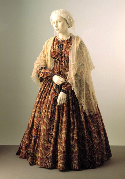 Compare this production still of Emily Cratchit to this dress from the collection of the V&A (designer unknown).