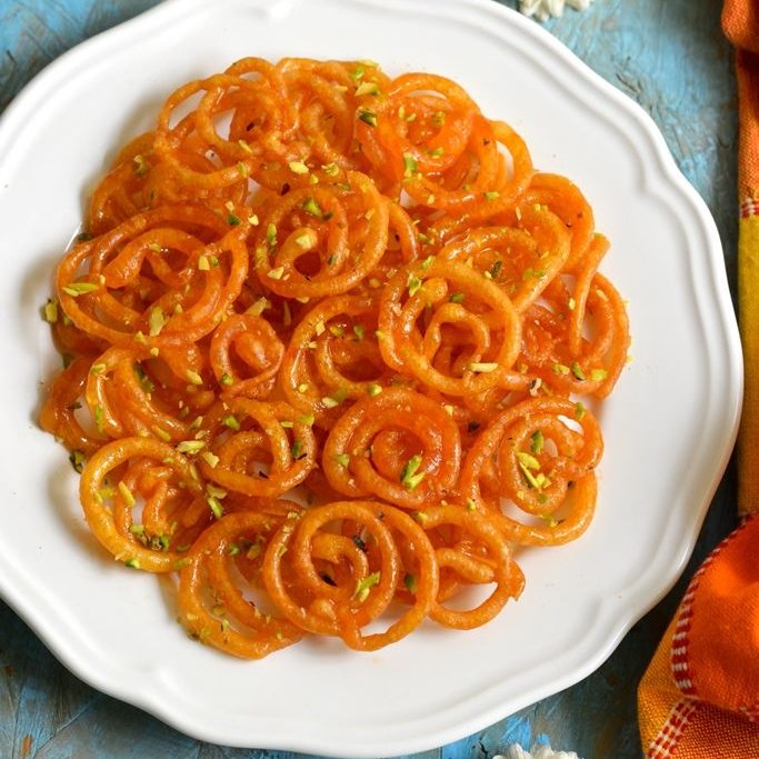 madame tracy - jalebitbh jalebi isn't my absolute favorite but everyone seems to love it so it's all good. it's fun! it's whimsical! fun shapes :)) swirlies :))) very very VERY sweet. crumchy u kno?