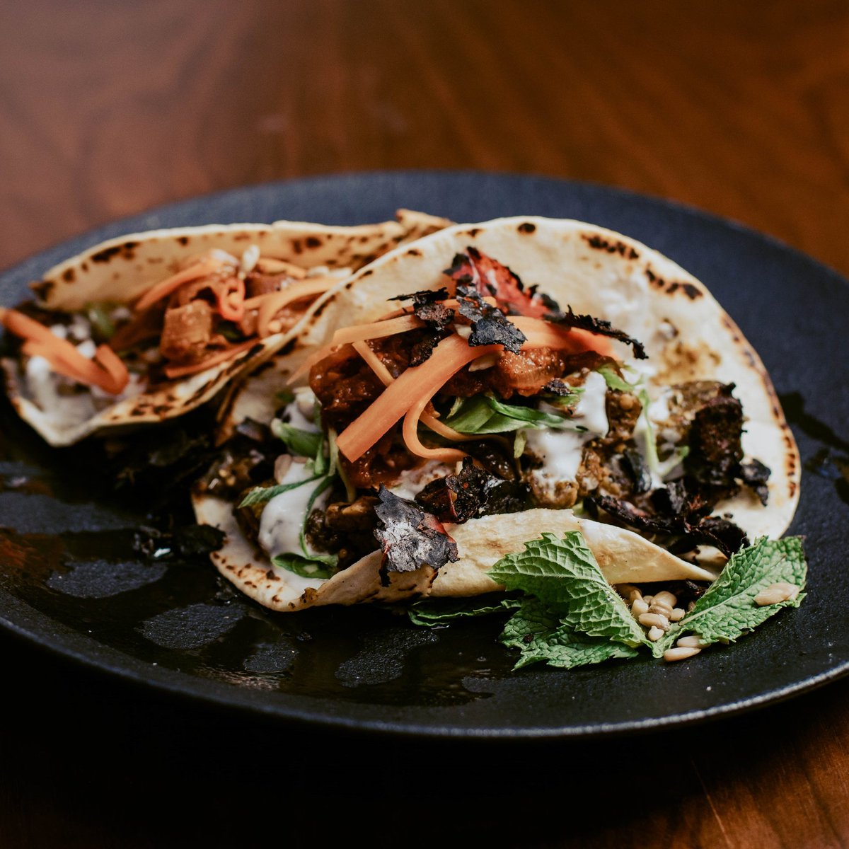 #repost @the_kitchenottawa on Insta
Our veggie tacos are made with grilled  zucchini, red onion, red pepper, eggplant, and cheddar cheese wrapped in flour tortillas. Served with radish slaw + crema. 😋 Want some? Visit our City Centre patio or order from The Kitchen on Uber Eats.