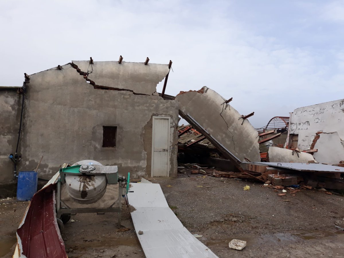 #1: likely F2 that severely damaged several stone/concrete farm buildings along with a few roofs, trees and power poles. A train was struck and two people were injuried when the windows blew out