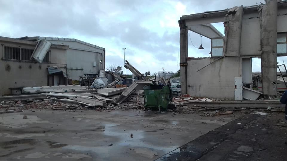 #7: likely F2 that hit an industrial area where it destroyed numerous roofs and severely damaged a few buildings. A few cars were piled on top of each other and trees, poles and billboards were downed or damaged