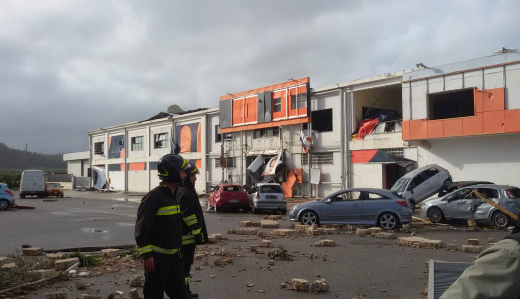 #7: likely F2 that hit an industrial area where it destroyed numerous roofs and severely damaged a few buildings. A few cars were piled on top of each other and trees, poles and billboards were downed or damaged