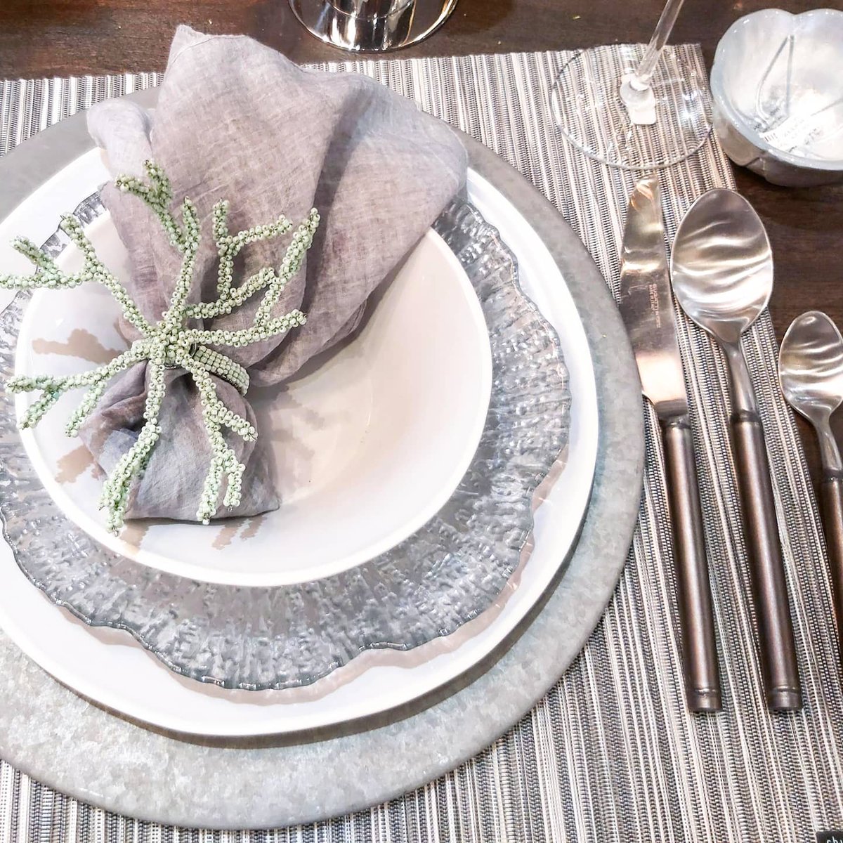 Succulents and the natural tones of grapevine bring just the right amount of warmth to the grey. They pair exceptionally well with our tin accents. #tablesettingideas #kelownadecor #kelownahome #centrepieceideas