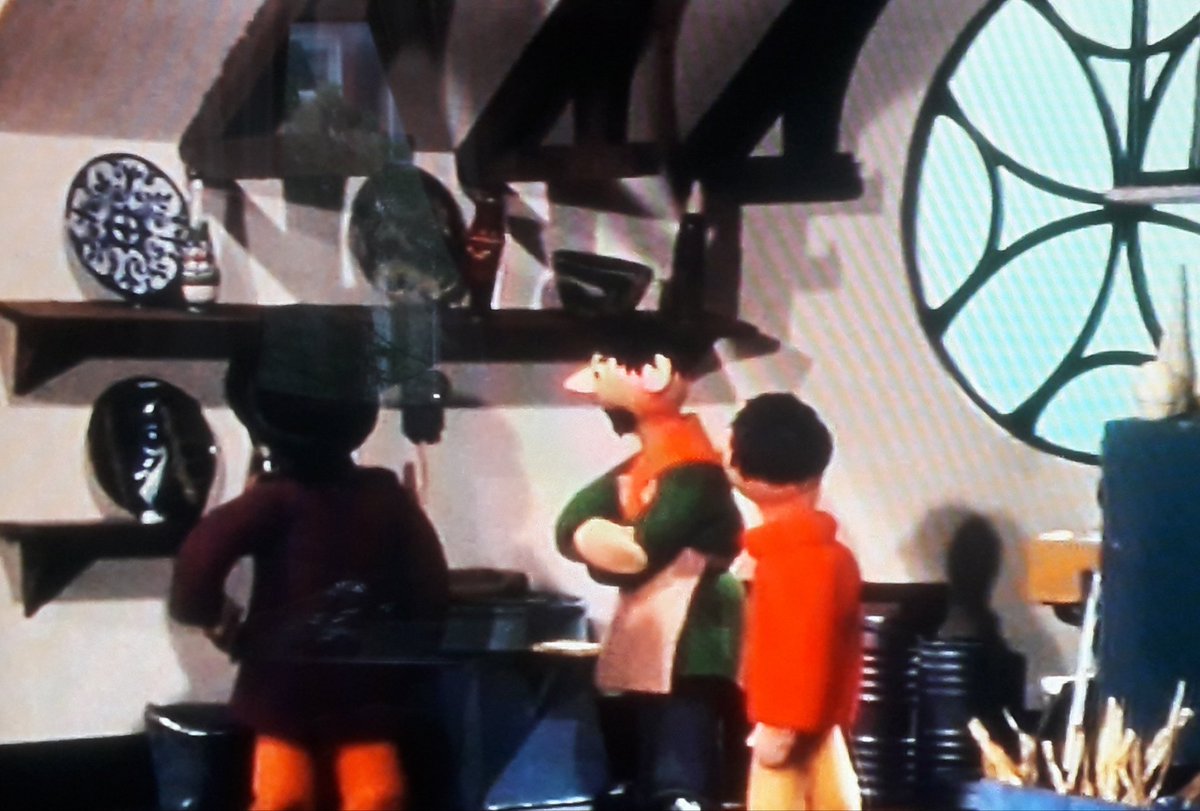 We also get to see the studio interior, with that impressive decorative window, and examples of his pottery on display.