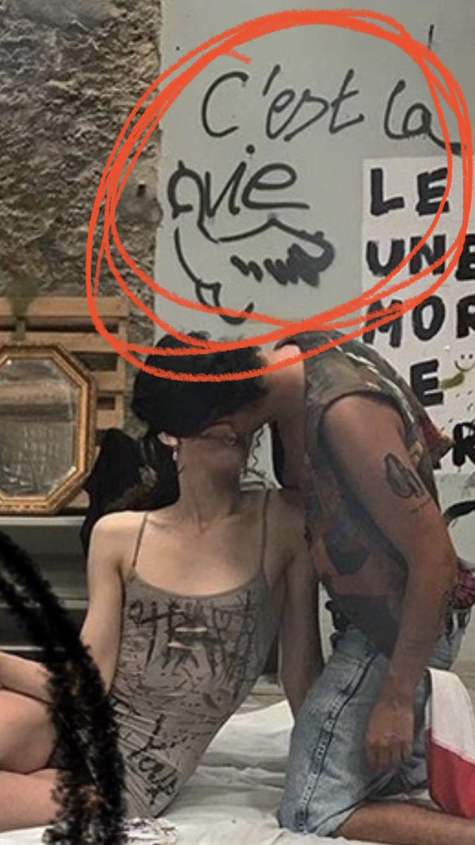 This is a photo of a celbration that the Trans Activits held in L'Amazone after the eviction of the feminists. They defaced the women's art and activism and tagged "Thats life" along with a drawing of a penis beside a collage honouring a woman who was murdered by her partner.