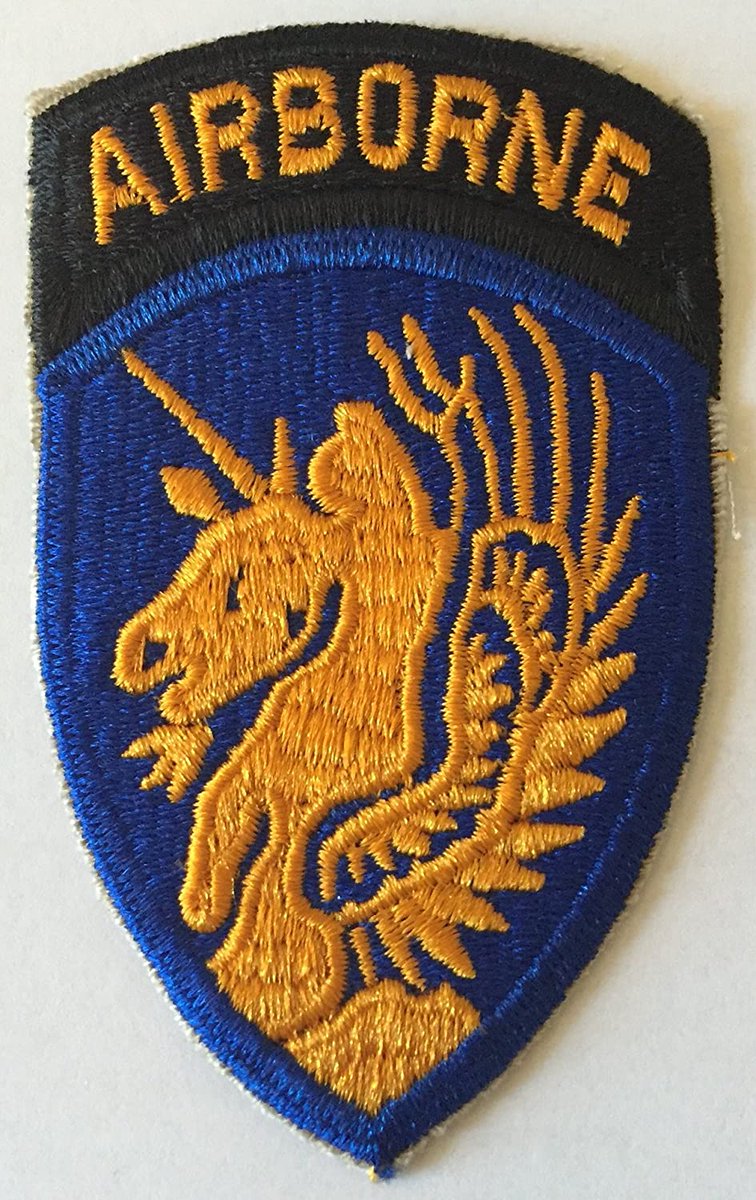 27 of 56The division's shoulder patch was a winged unicorn in orange on an ultramarine blue (the branch of service colors of the United States Army Air Corps) with a gold on black "Airborne" tab above the insignia.