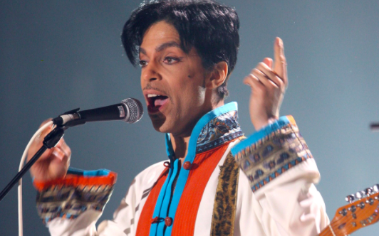 The cream & turquoise outfit features a signature mandarin collar, contrast piping, braiding and bell sleeves. Prince wore a similar outfit around this time during live performances with bold contrast panelling & embroidered trim. This look read more graphic whilst on stage.