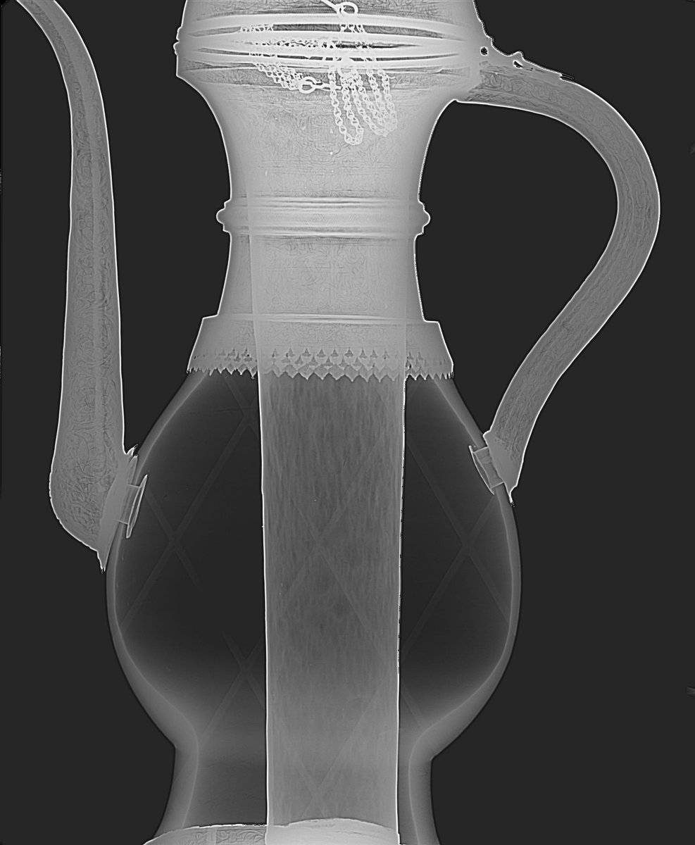 The key thing about this type of ewer is that it has a cylindrical internal container, made of metal, which would be filled with ice, to chill the liquid around it, without contaminating it. The set up can be seen really neatly in the x-ray here. (This is V&A 555-1878) [2]
