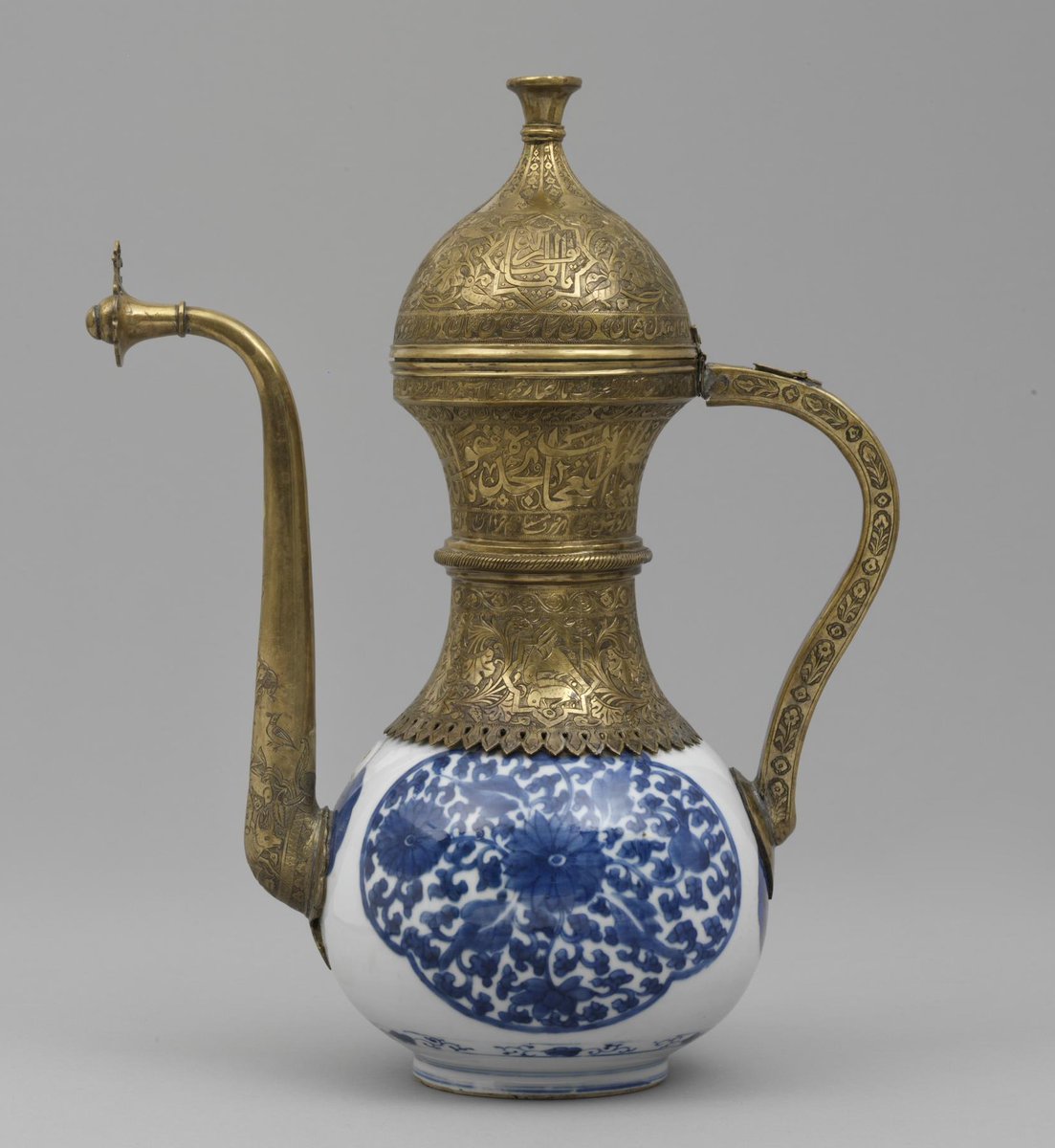 Here is another example of this type with a re-purposed Chinese vase - this one porcelain, of the blue-and-white kind, from the late-17th century. Here, all the fittings (again 19th-century) are copper alloy, and you can see that hole in the handle again. (V&A 476-1876) [5]