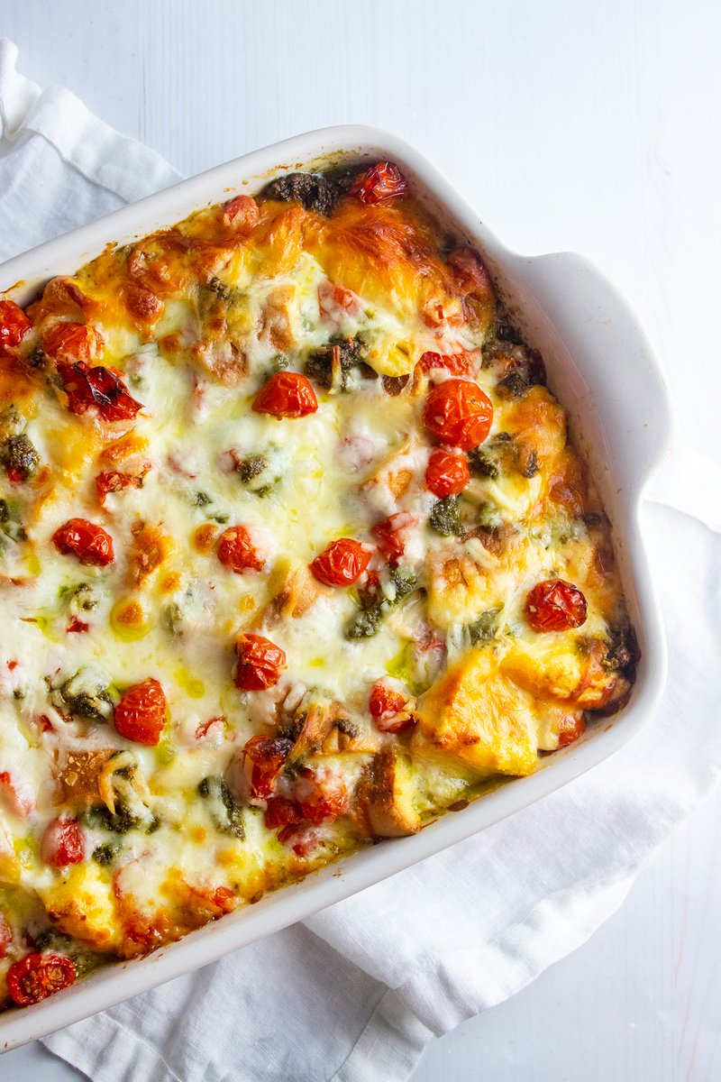 Giadzy's tweet photo. Say 👋 to the tastiest make-ahead breakfast for summer: the Caprese Strata. This breakfast casserole is loaded with broiled cherry tomatoes, pesto, mozzarella, and the secret ingredient: @thomasbreakfast bagels. 🙌  #Thomas140 #ad https://t.co/h56bBTHLvs https://t.co/umCUnaIWlN