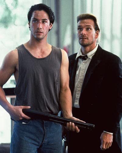4. point break. an fbi agent who surfs to catch bad guys but actually ends up liking it?? sounds hot to me.