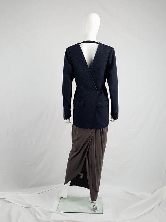 overall, margiela explored numerous subjects and motifs in a innovative and new way of communicating ideas, and one characteristic of the brand, sometimes, were clothing being worn backwards, like as these blazers and the pants
