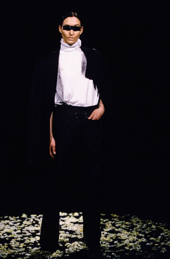 overall, margiela explored numerous subjects and motifs in a innovative and new way of communicating ideas, and one characteristic of the brand, sometimes, were clothing being worn backwards, like as these blazers and the pants