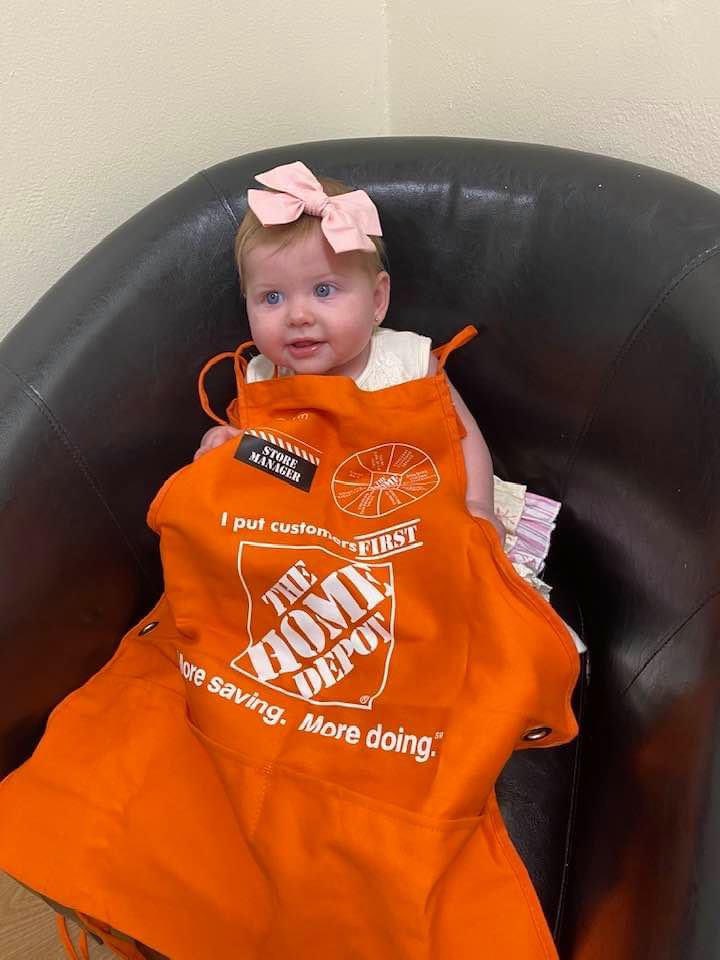 Store manager in the making.   My little granddaughter trying on some orange today.   😂
