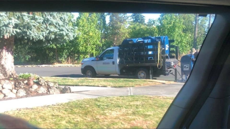 Mailboxes in Portland being loaded onto the back of a truck. One of many methods being used to interfere with mail-in ballots for the 2020 presidential election. Photo taken by  @Intersection911