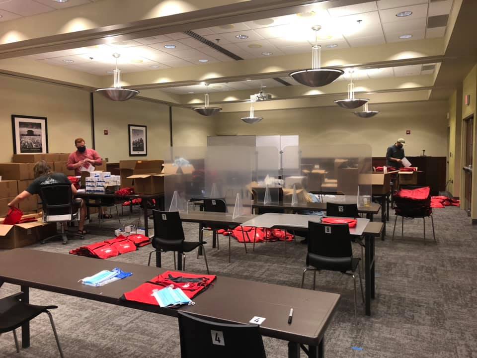 uawaltoncollege's tweet photo. Check out our Walton Conference Hub team assembling 26,000 (yes, 26,000!) student safety kits, complete with masks, hand sanitizer, thermometers and guidelines for ALL @uarkansas students! #BeEpic #razorbackstogether #WPS #maskupArkansas https://t.co/pymMrferq0