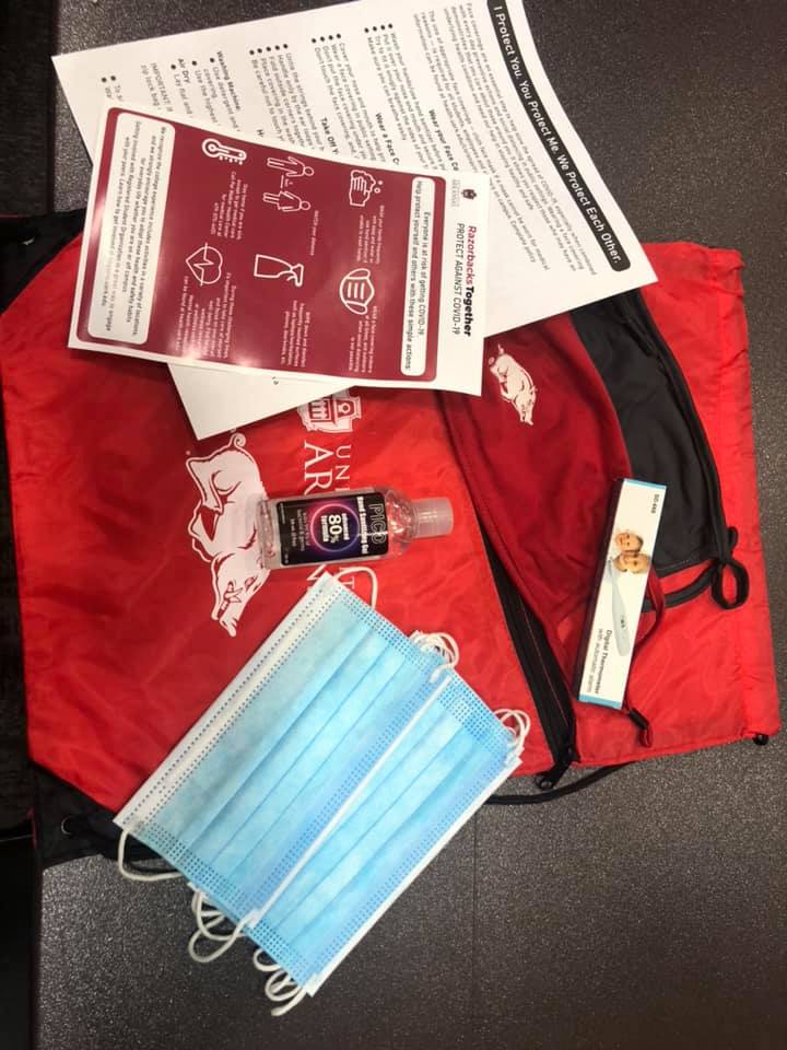 uawaltoncollege's tweet photo. Check out our Walton Conference Hub team assembling 26,000 (yes, 26,000!) student safety kits, complete with masks, hand sanitizer, thermometers and guidelines for ALL @uarkansas students! #BeEpic #razorbackstogether #WPS #maskupArkansas https://t.co/pymMrferq0