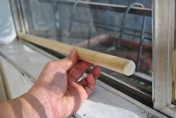 Go to your local hardware store and buy several 1/2 inch wooden dowels. Cut them to fit on the inside track of your windows and sliding glass door.Even if your window is unlocked, it will get stuck on the dowel