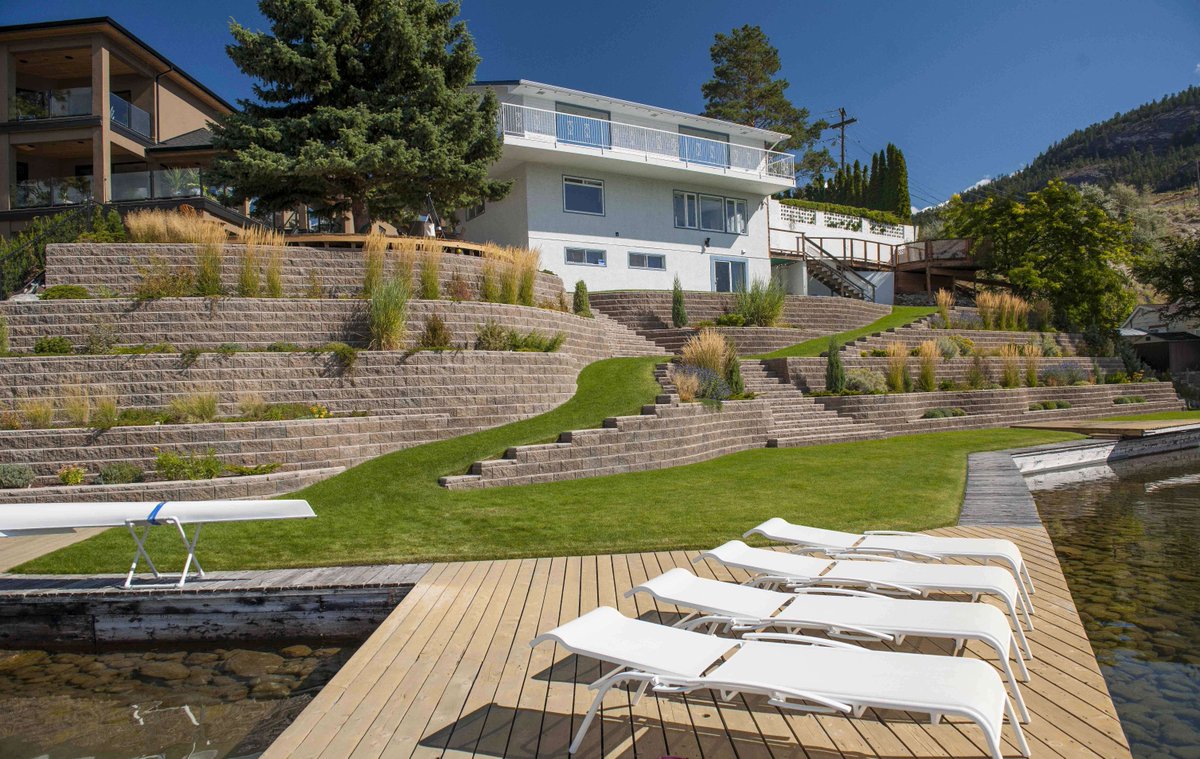 Holidays in your own home. Why not?☀️
Enjoying it in this beautiful backyard featuring a grand staircase of our AB® Blocks from our Legacy collection.
#retainingwall #lakefront
Contractor: Block by Block Landscaping Ltd.
<a href="/Belgard/">Belgard</a> <a href="/AllanBlockWalls/">info@allanblock.com</a> #staycation #hardscapedesign