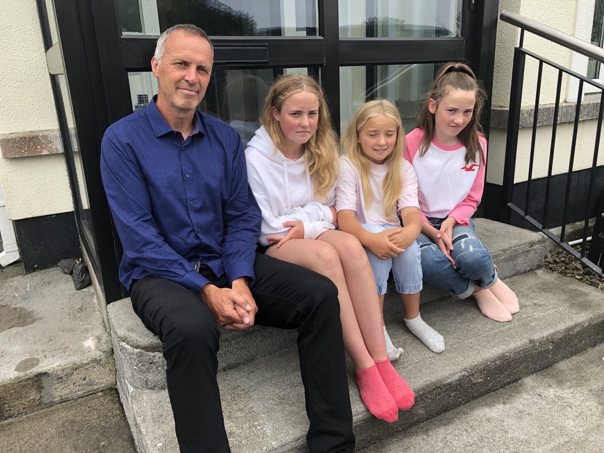 TeresaMannion's tweet photo. Johnny Glynn at home with his three daughters Hannah, Clara and Alice as they await news of Ellen and cousin Sara Feeney at UHG following their recovery yesterday ⁦@RTENewsNow⁩ #GalwayGirls https://t.co/cxei7TvD8O