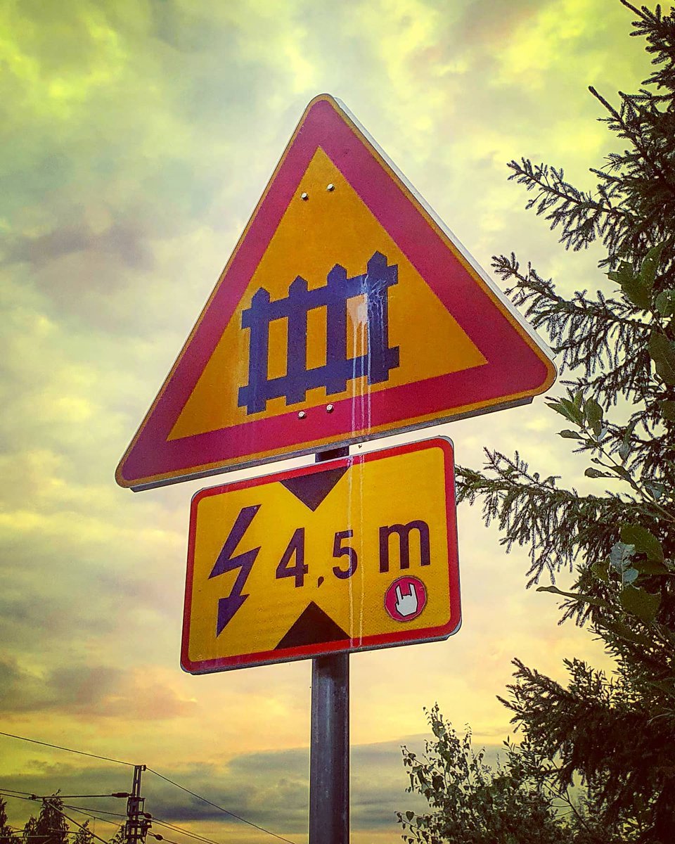 Railroad crossing ahead. Beware of the power cables. So metal! 🤘 #railroad #crossing #powercables #gamedev #inspiration #signs