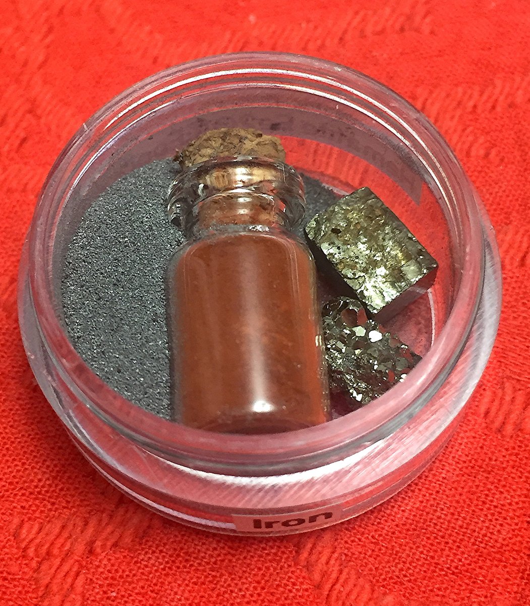 Iron  #elementphotos. Red powder is Hematite (Fe2O3), while the large crystals are Fool's Gold which, as the name suggests, contains no gold (iron pyrites, FeS2).