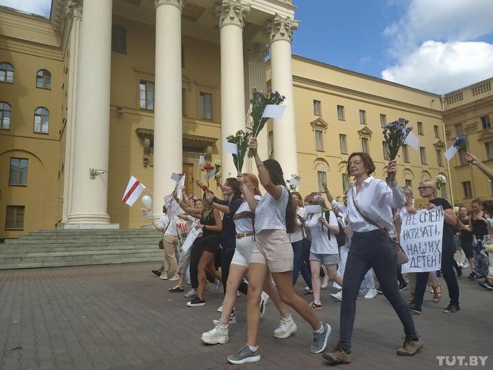 Women in white in front of KGB. photo:  @tutby