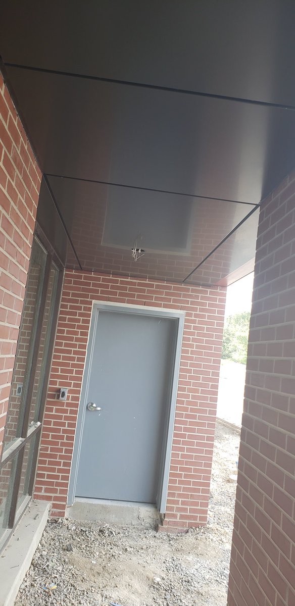 FairfieldMetal's tweet image. The Poplar Apartments finished canopy highlights the entrance. The SBR-Bronze #Alpolic is approximately 300 square feet #metalfabrication Arcitect @BlackneyHayes