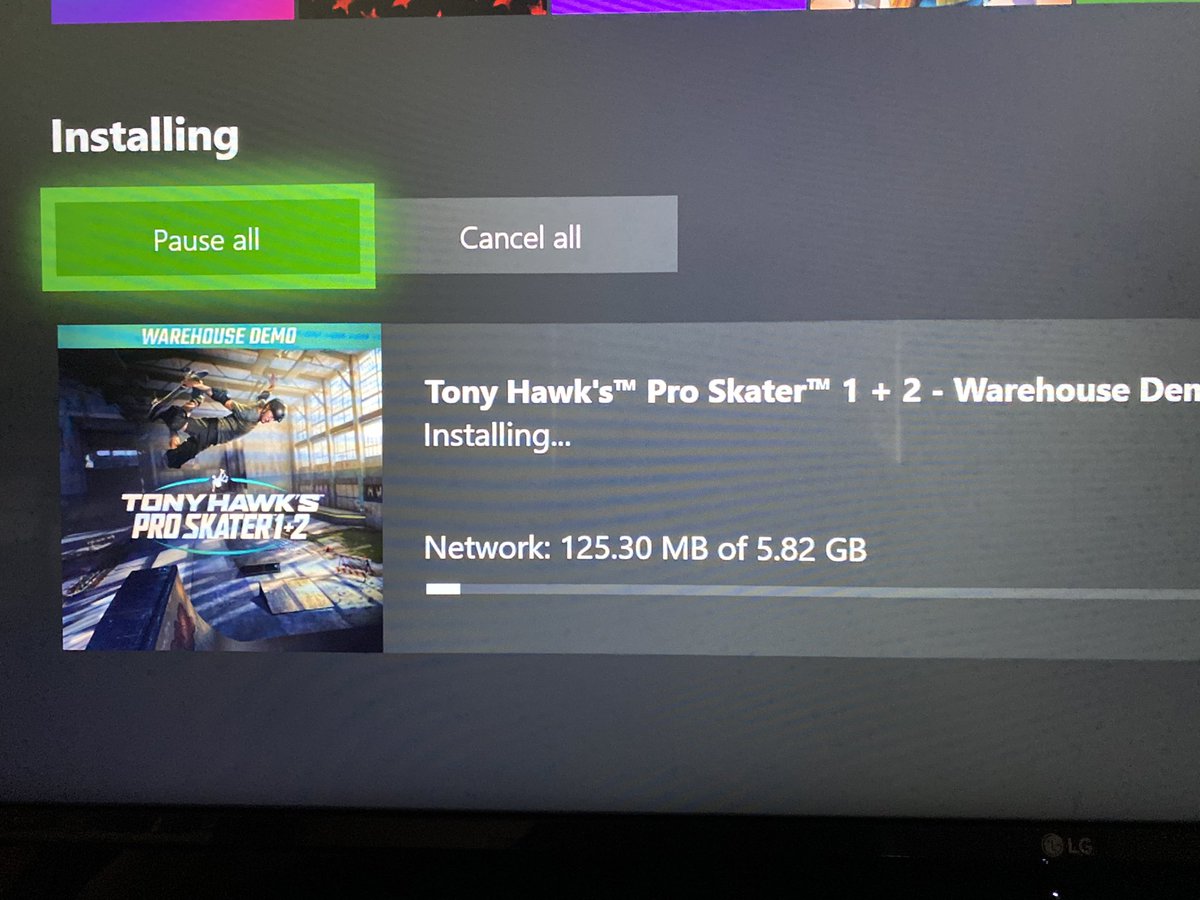 Photo of my Xbox downloading the Tony Hawk demo