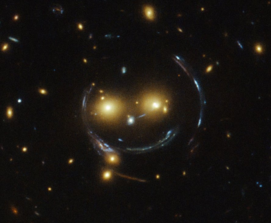 Here is another BEAUTIFUL example of this phenomenon (called Gravitational Lensing)This is called the "The Cheshire Cat Group of galaxies": see the two eyes and the weird smile??? Well the smile (and the other stretchy bits) are DISTANT GALAXIES 3/6