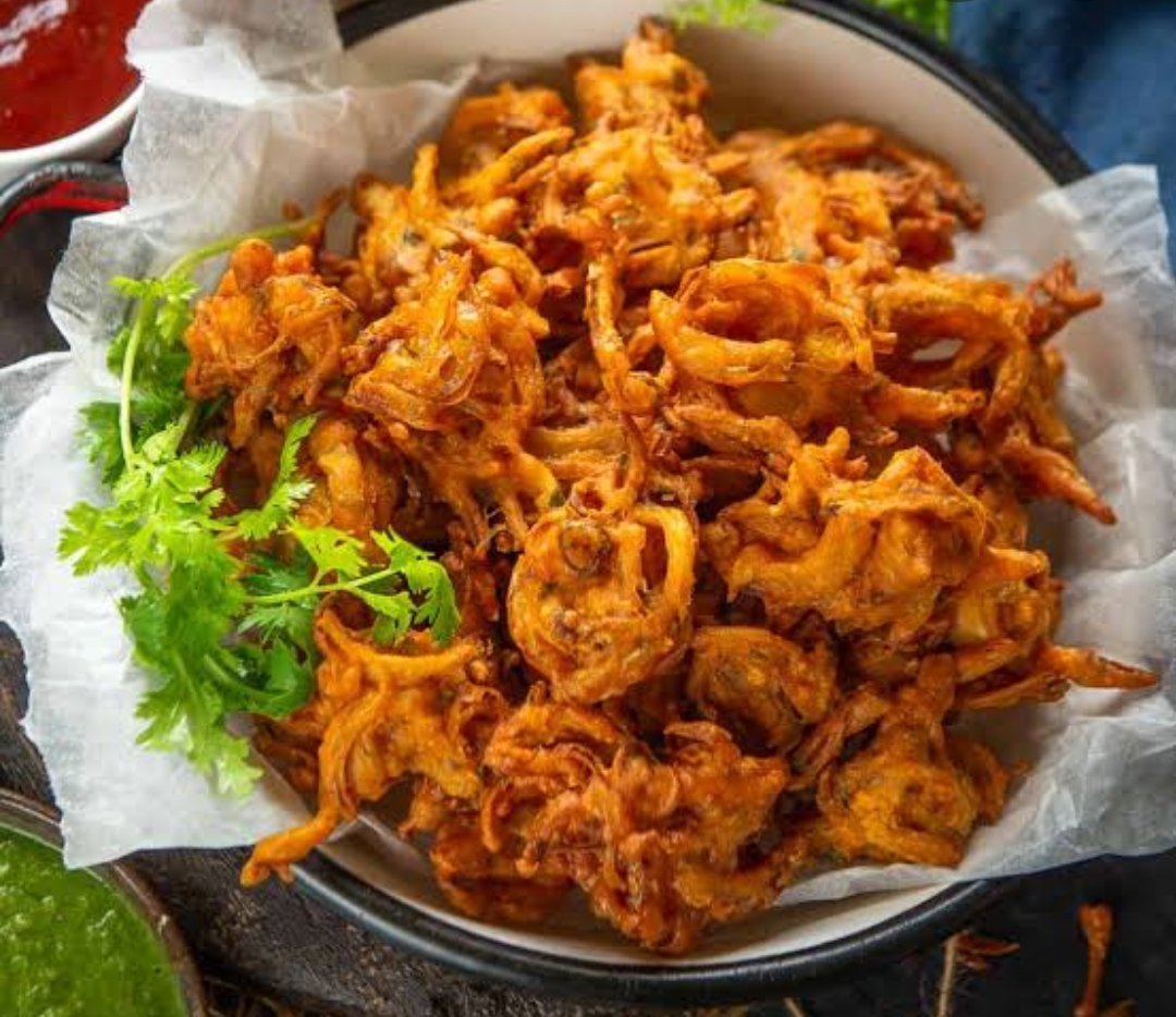 12. Pyaji (Pyajua) : This is the most common Fritter accross India but every where it's called "Pyaz ke Pakode" Except in Bihar. Its called Pyaji. Onions are halved and thinly sliced.Besan, spices are added and deep fried in round shape.