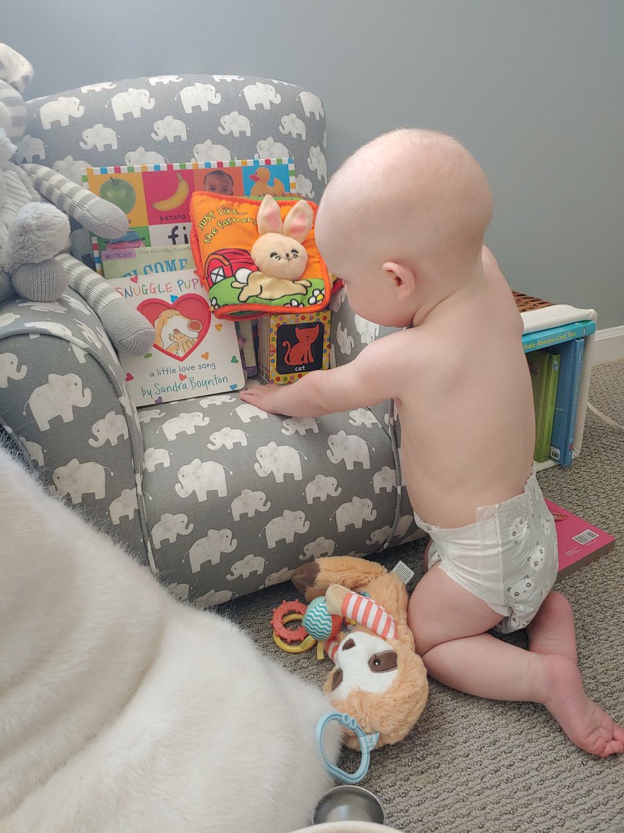 KatieBittner1's tweet photo. If you leave this kid in his room for 10 seconds he will find his way to the reading chair. I am not sure why I spend money on toys when all he cared about are his books.  #formerteacherskid #booklover #pleaseexcusethemess https://t.co/hXemKtVtsd