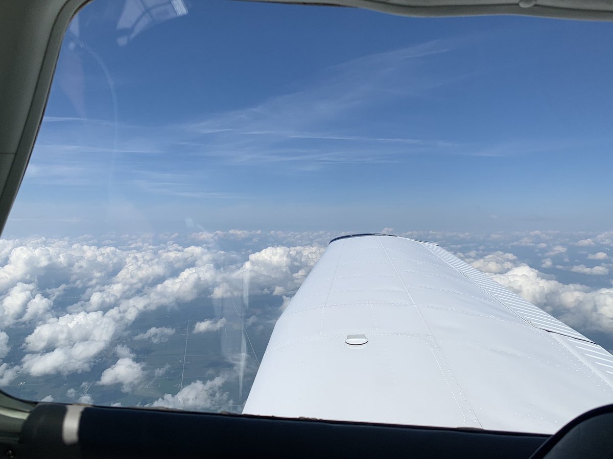 While the weather was typical summer heat and humidity on the ground (and no A/C in the plane), it was great flying weather at altitude, with just some scattered clouds and nice, cool air.