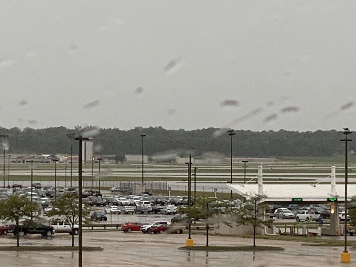 Through my hotel window, which looked directly out at the airport, I saw the storm’s approach, then watched as it lashed the airfield, laying the tree in front of my window nearly flat, shredding flags on the airport’s flagpoles, and knocking out out the hotel’s power.