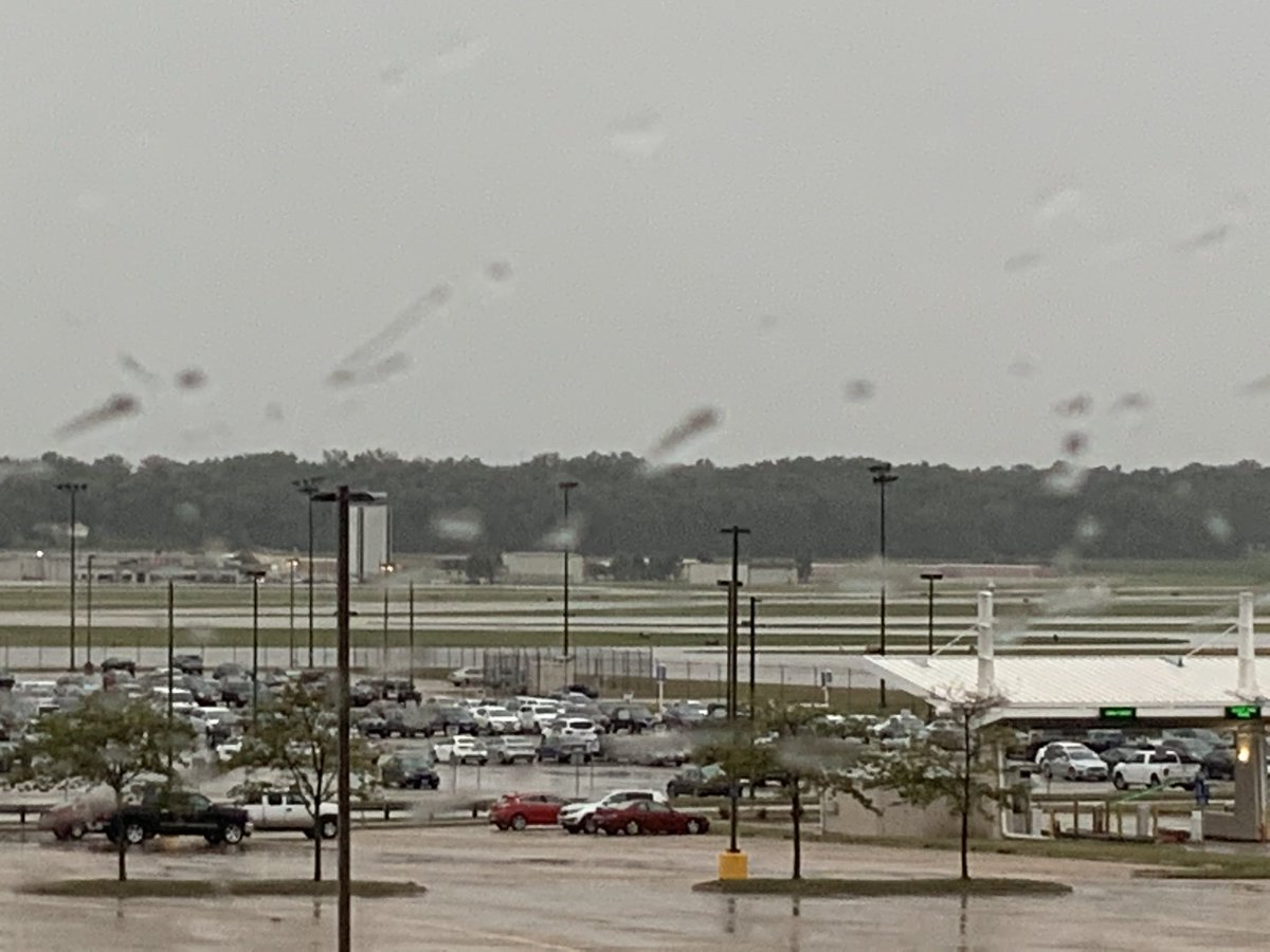 Through my hotel window, which looked directly out at the airport, I saw the storm’s approach, then watched as it lashed the airfield, laying the tree in front of my window nearly flat, shredding flags on the airport’s flagpoles, and knocking out out the hotel’s power.