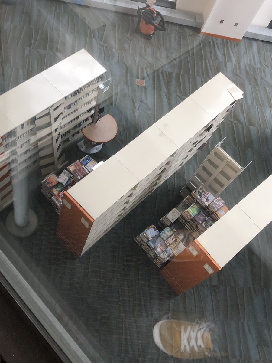 libraryprob's tweet photo. Here is a collection of things I found at the library last week. An egg....man. And we’re having construction in fiction - so they just. Piled. The books. Like this? This is the first weekend I won’t be working the hybrid desk, so here’s hoping I have more to show you tomorrow. https://t.co/Mxlg47KULy