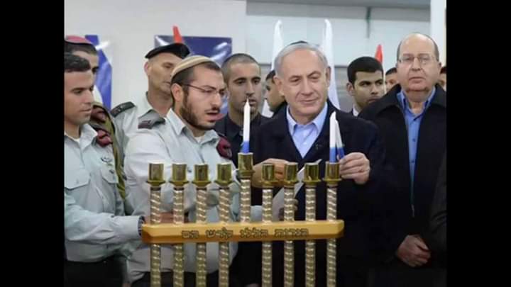 Are you blind or can you see what l see behind a certain war criminal?