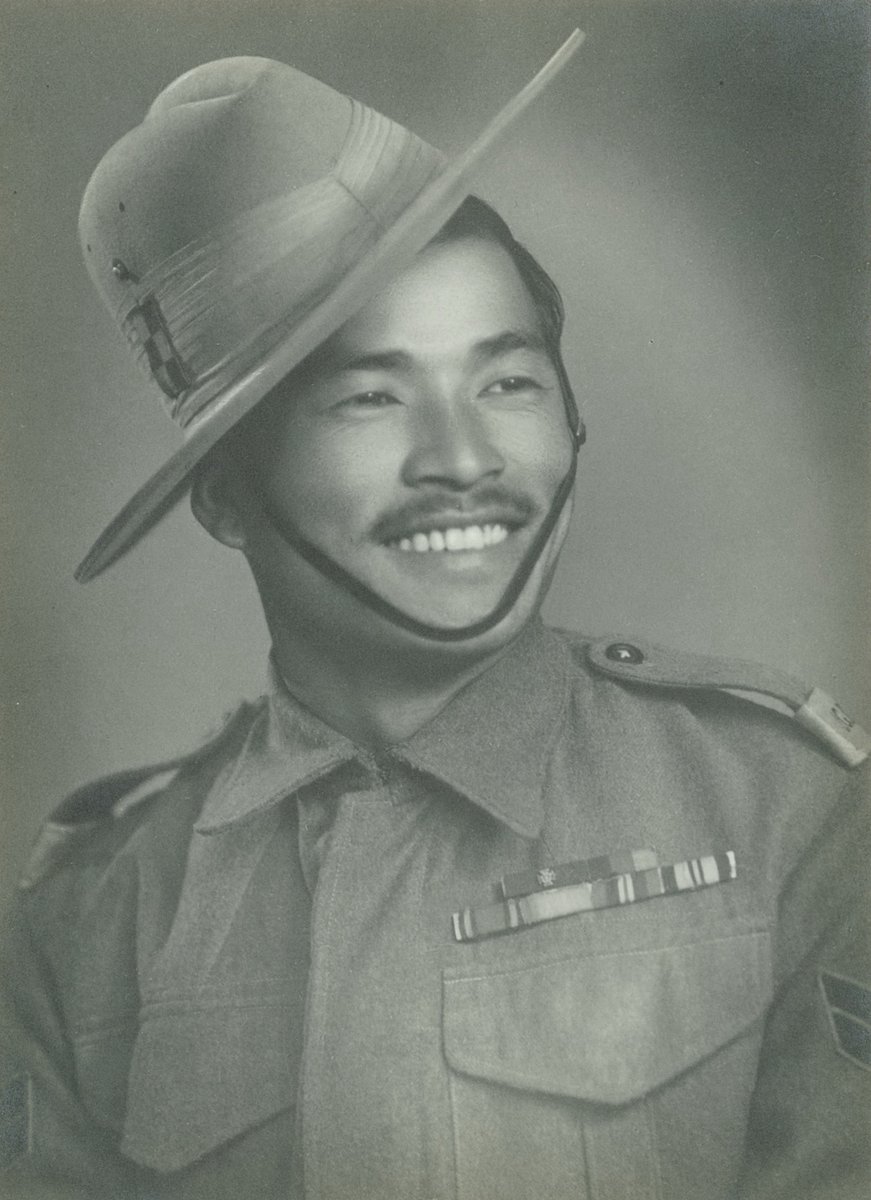 BritishArmy's tweet photo. Today marks the 75th anniversary of Victory over Japan Day. Capt Buddhi Gurung pays tribute to his grandfather, Rfn Bhanbhagta Gurung VC. Bhanbhagta was awarded the Victoria Cross for bravery during fighting in Burma in 1945. #VJDay75 #NeverForgotten  https://t.co/ANRzhkQvl3 https://t.co/GI4ov42bDe