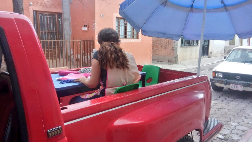 Flaminhaystack's tweet photo. This incredible teacher @Nay_EdEsp from Mexico has turned her pickup truck into a portable classroom whilst schools are closed due to #coronavirus 

She drives 2 hours a day to teach children with special needs who don't have books or access to the internet

This woman is amazing https://t.co/fMwtRVKg8E
