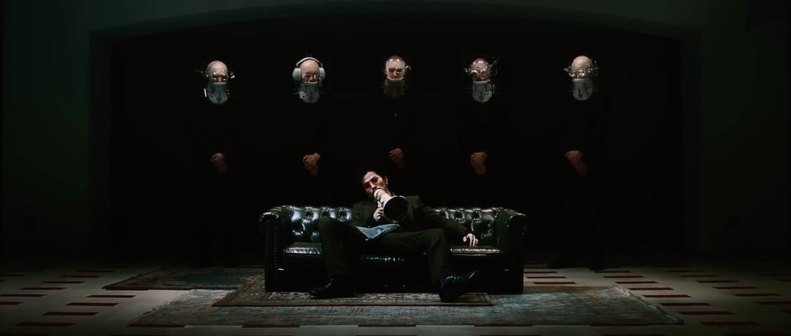 I love this shot! Daiki Tsuneta looks so cool.Note: Not all their head gear are the same. The guy in the middle only has one eye magnified. Others have both eyes magnified. Does this make them “more blinded”?The 2nd guy even has headphones. He tries to see, but never listens?