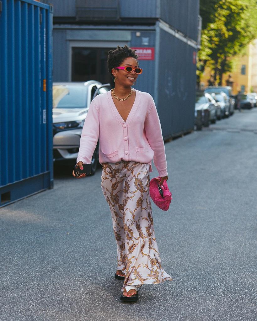 NETAPORTER's tweet image. Taking scandi style to the next level, Slip Into Style wears a &apos;70s-inspired slip skirt paired with a candy-colored cardigan. #TheNETSET bit.ly/30PaLf4