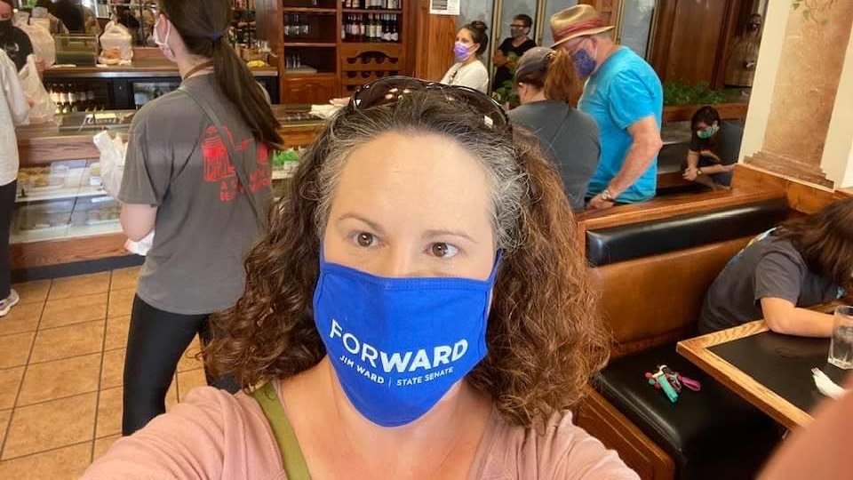 RepJimWard's tweet image. Supporter Emily Knorp-Brown Stone is helping move #KansasForWard at N&amp;amp;J's Global Market in Wichita with proceeds going to benefit the @RedCrossLebanon today! This event is running from 11am to 9pm! GREAT mask, Emily!