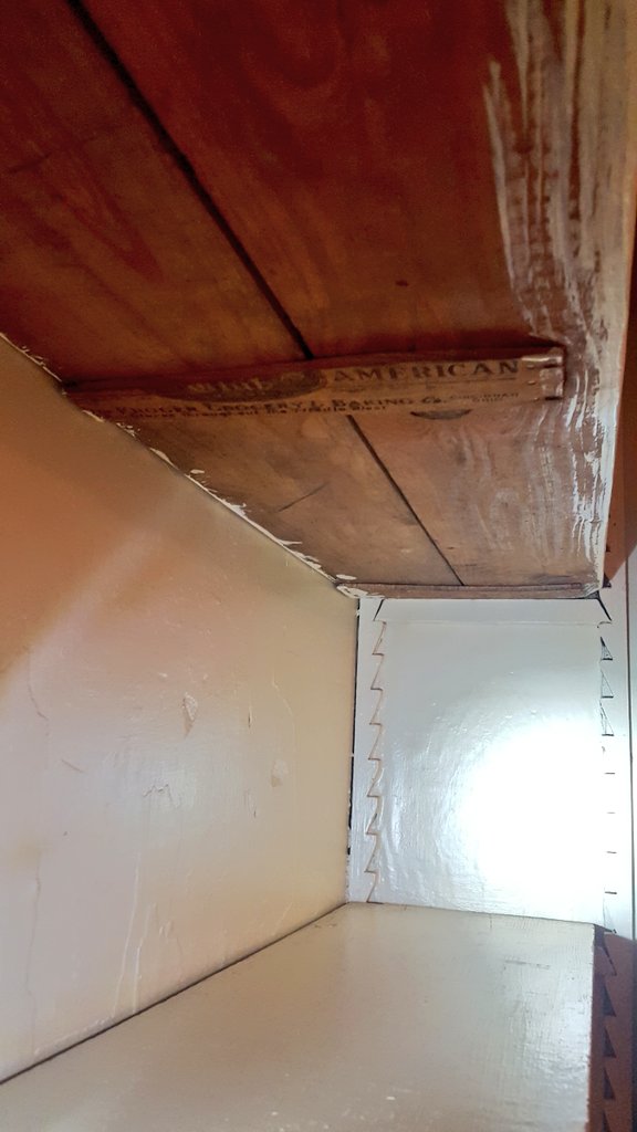 I'm restoring my century-old house and today I discovered a built-in bookshelf is held up by a strip of wood from a Kroger grocery box from 1921